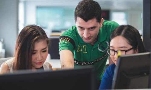 two women and one man on computer screen